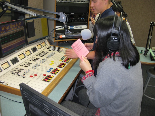 A Nanae High School student reads an on-air announcement advertising that Friday's CCHS football game  (PHOTO BY BEN HAYDOCK)